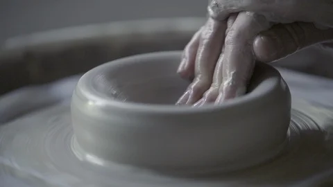 Potter molding clay on a potters wheel, Stock Video