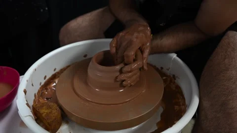Potter Opening Clay on Pottery Wheel. Basic Ceramic Technique Video stock 327453063