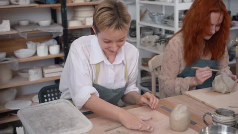 A potter prepares clay for clay modelling. Pottery workshop class. Video stock 222914389