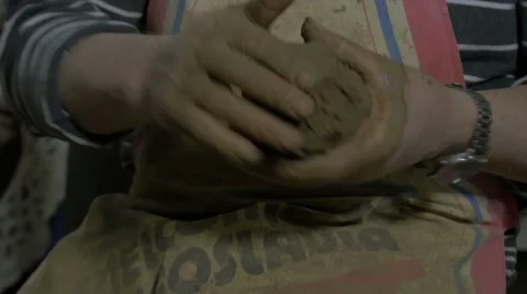 Potter preparing clay for making vase, hands close up, kneading clay for pottery Stock Footage 57630913