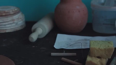 Potter rolls clay on the table Stock Footage 109275059