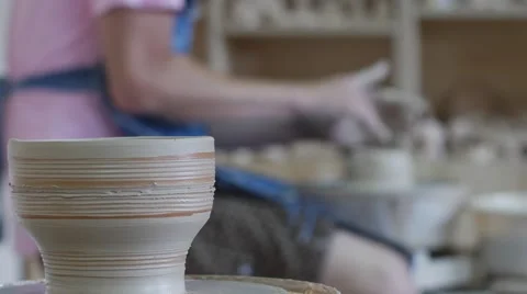Potter is Rotating a Wheel Making a Vase Pot Working on a Pottery Wheel Stock Footage 57991424