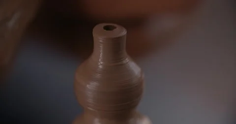 Potter sculpts a tiny ceramic jug in slow motion on a potter's wheel, small Stock Footage 151386103