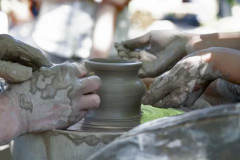 Potter shaping a ceramic pot Stock Photos