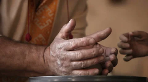 Potter shows pot making process to little girl Stockbeeldmateriaal 24469461