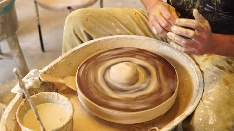 Potter starting wheel and centering clay for bowl Stock Footage 329405268