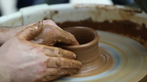 Potter teaches to make a clay pot Stock Footage 122495233