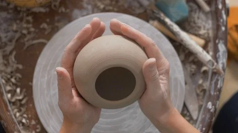 Potter twists in the hands of pottery. The view from the top Stock Footage 127954980