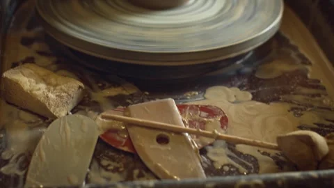 A potter using a potter's wheel making a vase Stock Footage 278311654
