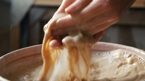 Potter wet hands before work Stock Footage 102306311