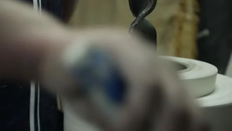 Potter wheel. Hands remove the form for the billet Video stock 130526449