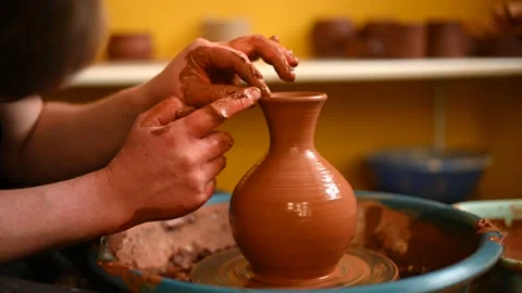Potter at work on circle wheel in workshop Stock Footage 150309849