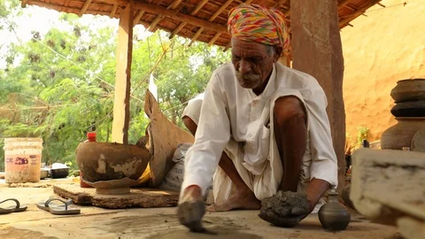 Potter at work makes ceramic dishes. India, Rajasthan. Stock Footage 120488156