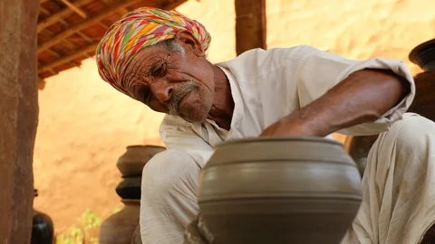 Potter at work makes ceramic dishes. India, Rajasthan. Stock Footage 120488226