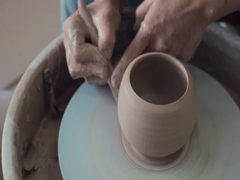 Potter work On A Spinning Pottery Wheel. The Jug is ready Stock-Footage 72280486