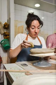 Potter working on clay in pottery workshop Stock Photos