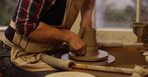 Potter working with clay on a spinning wheel. Stock Footage 60222456