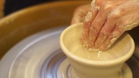 Potter working clay on throwing wheel Stock Footage 71939864