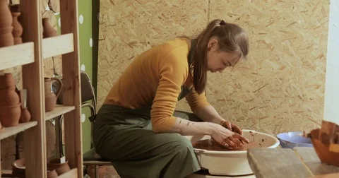 Potter working on the potter's wheel Stock Footage 74732055