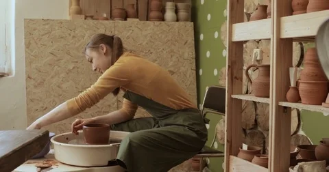 Potter working on the potter's wheel Stock Footage 74736267