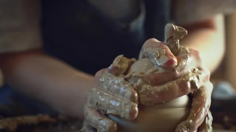 Potter working on a Potter's wheel making a vase Stock Footage 278311154