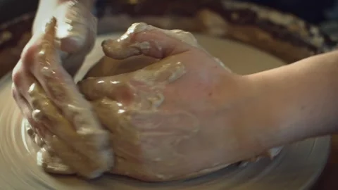 Potter working on a Potter's wheel making a vase Stock Footage 278311227