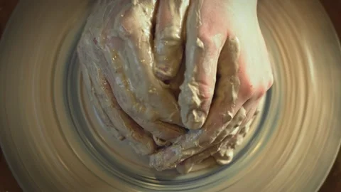 Potter working on a Potter's wheel making a vase Stock Footage 278311235
