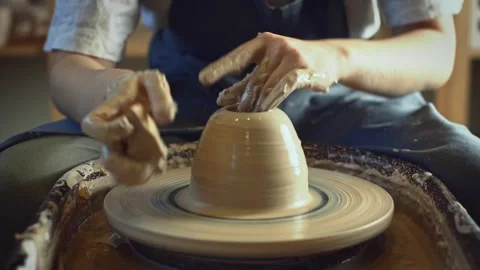 Potter working on a Potter's wheel making a vase Stock Footage 278311248