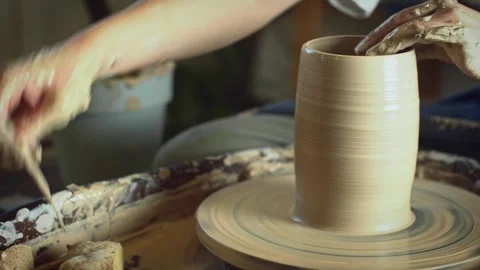 Potter working on a Potter's wheel making a vase Stock Footage 278311297