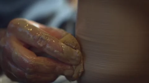 Potter working on a Potter's wheel making a vase Stock Footage 278311449