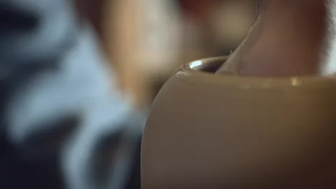 Potter working on a Potter's wheel making a vase Stock Footage 278311524