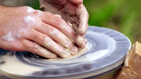 Potter working with wet clay on a wheel Stock Footage 115081925