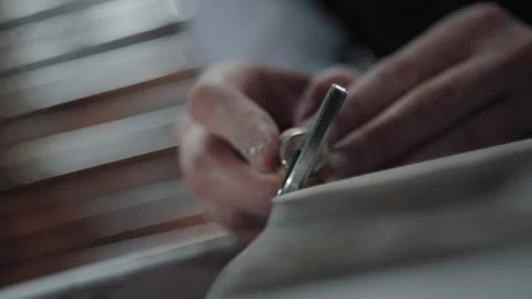 The potter works as a tool a loop and removes excess clay. Video stock 257224830