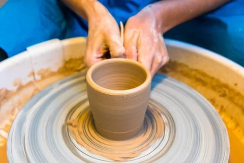 Pottering - creating a clay cup in process Stock Photos