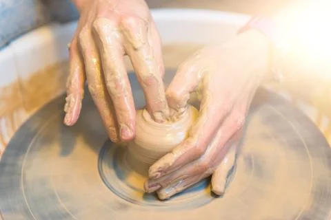 Pottering - creating a clay cup in process Stock Photos