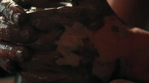 Potters hands centering clay on pottery wheel Stock Footage 275087330