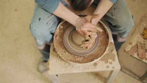 Potters hands close up making creating ceramic jar vase pot on pottery wheel  動画素材 87297771