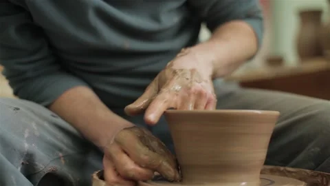 Potters hands close up making creating ceramic jar vase pot on pottery wheel  스톡 동영상 87478029