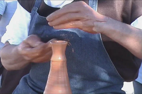 Potters hands creating a clay vase Video stock 111550