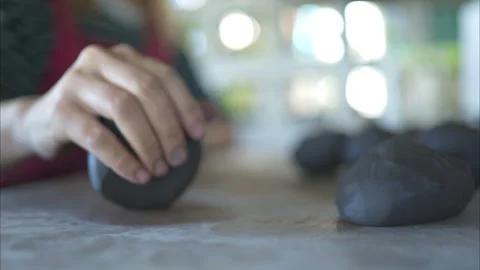 Potter's hands kneading clay to make a vase shape. Stock Footage 260306332