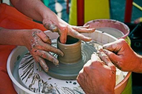Potter's hands Stock Photos