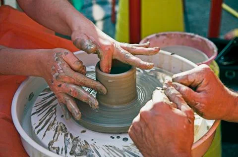 Potter's hands Stock Photos