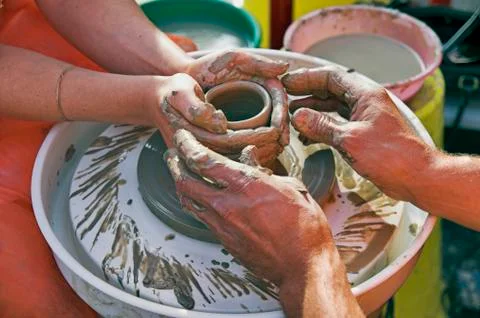 Potter's hands Stock Photos