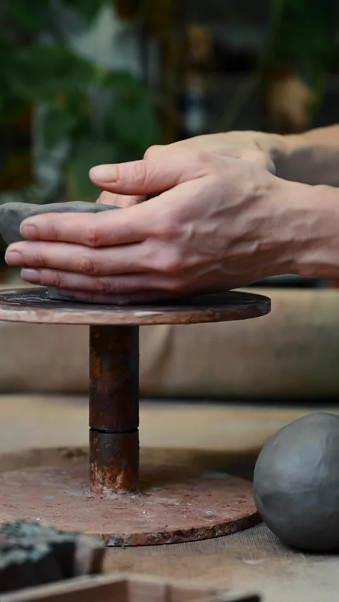 Potter's wheel for hand work, Master makes a plate by hand Stock Footage 293607279