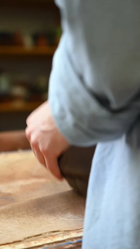 Potter's wheel for hand work, Master makes a plate by hand. Vertical format Stock Footage 293738424