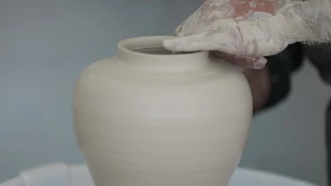 Potters wheel, hands forms clay pot on potter's wheel, Stock Footage 144666939