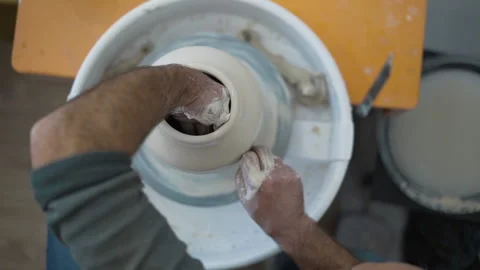 Potters wheel, hands forms clay pot on potter's wheel, 動画素材 144666963