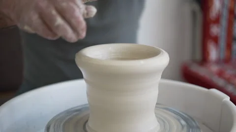 Potters wheel, hands forms clay pot on potter's wheel, Stock Footage 144666987