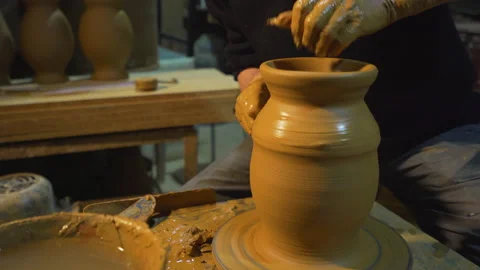 Potters wheel, hands forms clay pot on potter's wheel, Stock Footage 147261088