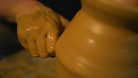 Potters wheel, hands forms clay pot on potter's wheel Stock Footage 147270610